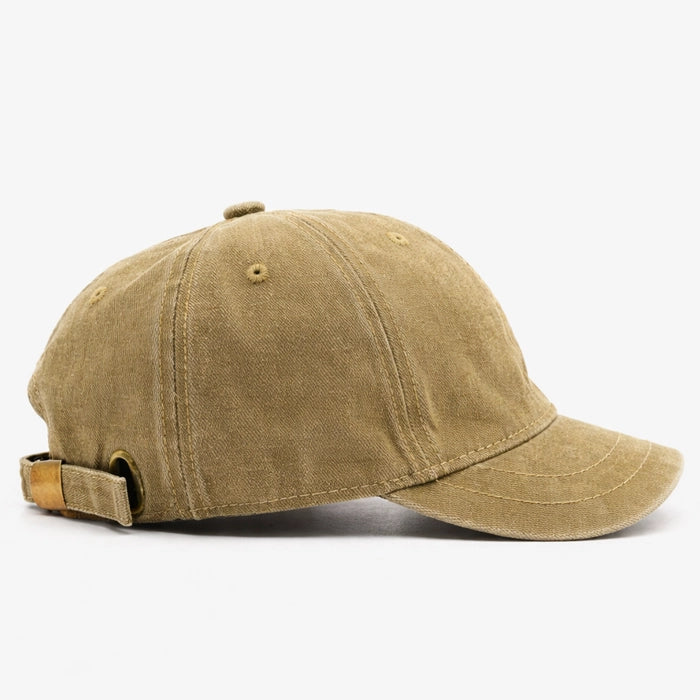 Washed beige cotton dad hat baseball cap with vintage distressed effect, designed for casual and sporty occasions.