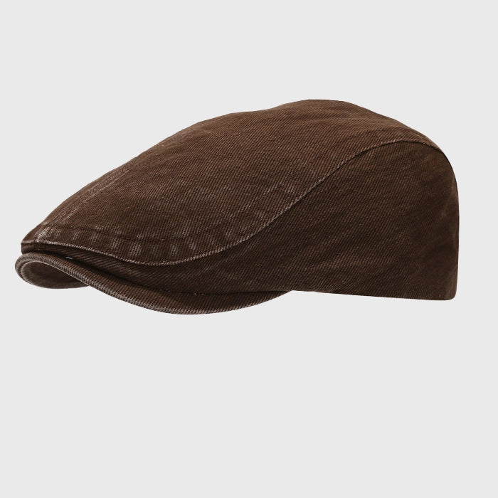 Vintage washed flat cap with adjustable fit. A casual ivy cap style with a relaxed, comfortable design for everyday wear.