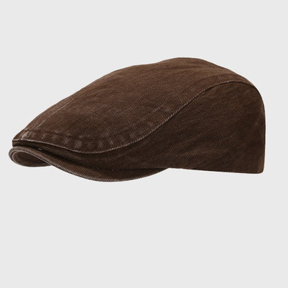 Vintage washed flat cap with adjustable fit. A casual ivy cap style with a relaxed, comfortable design for everyday wear.