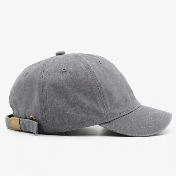 Washed grey cotton dad hat baseball cap with distressed detailing, adjustable fit for a comfortable and casual look.