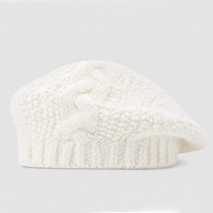 Elegant white cable knit beret for women, perfect for cozy winter styling. Crochet design and adjustable size for comfort. Ideal for chic winter outfits.