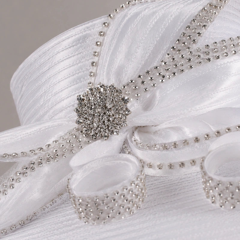 Close-up of white church hat with sparkling rhinestone loops, elegant women’s formal headwear.
