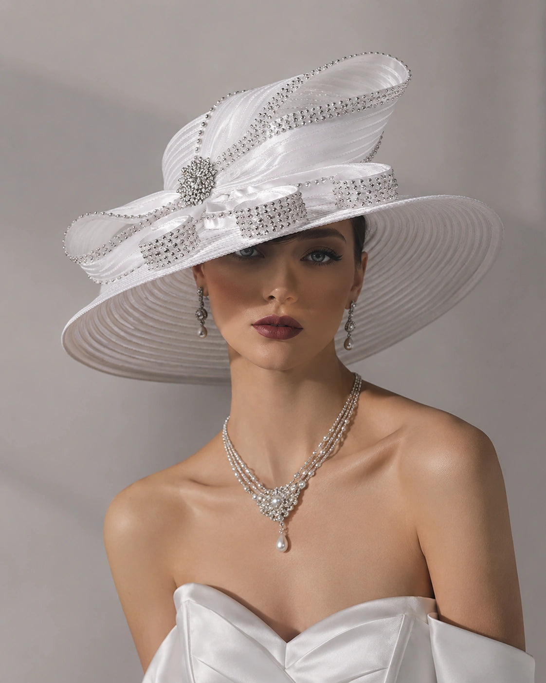 Model wearing white church hat with rhinestones and satin bow, perfect Easter or bridal Sunday hat.