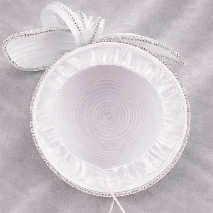 Close-up of a white satin church hat with crystal embellishments, designed for weddings and formal events.