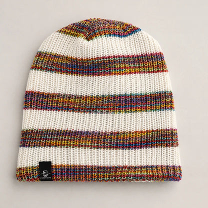 White knit beanie with rainbow stripe details and cozy soft winter texture
