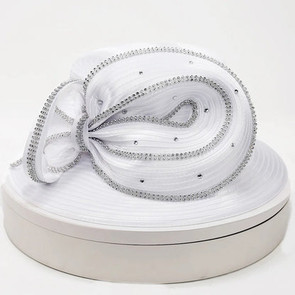 Front view of an elegant white church hat with rhinestone trim, worn by a mannequin with pearl jewelry, ideal for weddings and Sunday service.