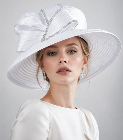 White wide brim church hat with rhinestone bow worn by woman for Sunday service