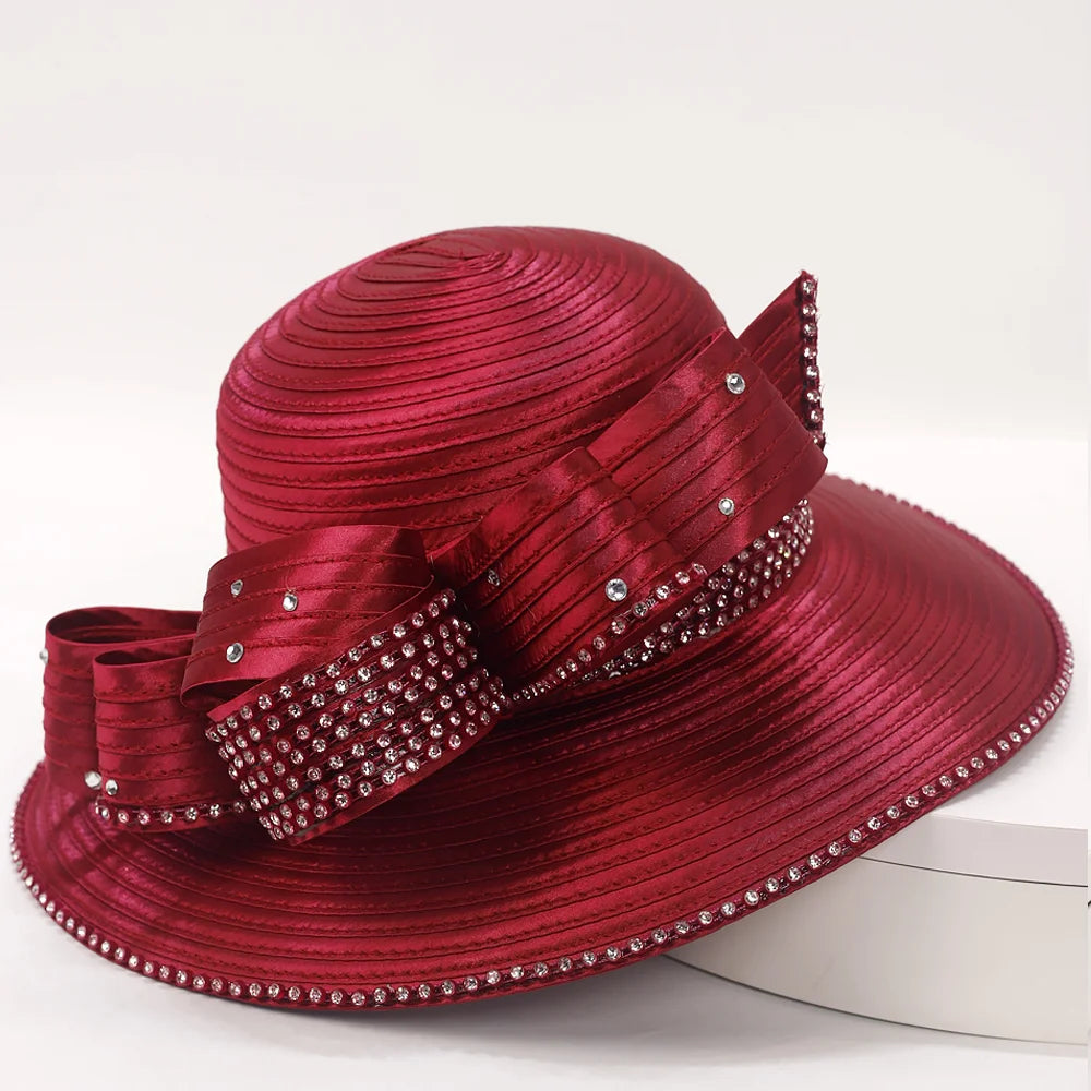 Side view of a wine-red formal hat suitable for church or weddings.
