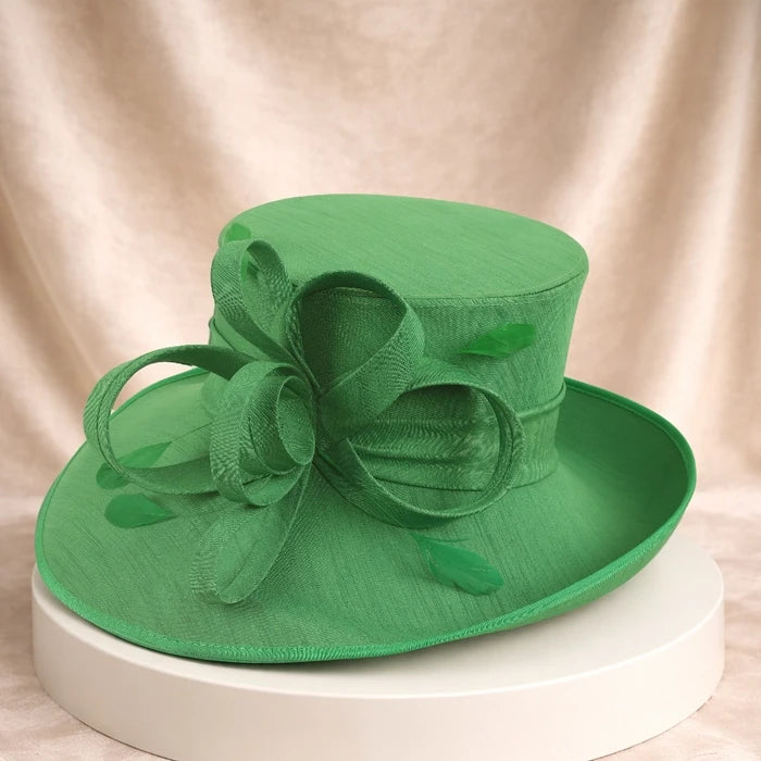 Stunning green women's church hat with floral decorations, perfect for spring and summer events
