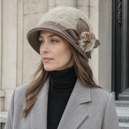 Woman styling a cream Angora cloche hat with a gray coat for fall and winter
