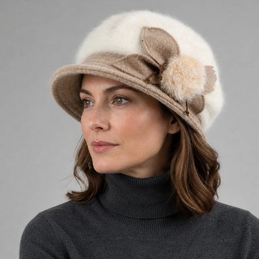 Woman wearing a cream Angora cloche hat with a flexible brim and flower detail