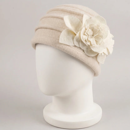 Cream brimless boiled wool cloche hat with ruched crown and fixed flower