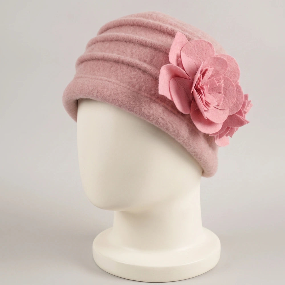 Pink brimless boiled wool cloche hat with layered ruching and floral detail