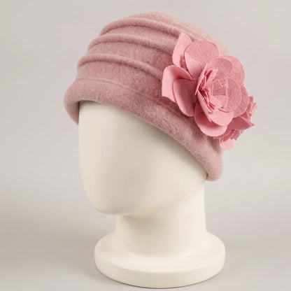 Pink brimless boiled wool cloche hat with layered ruching and floral detail