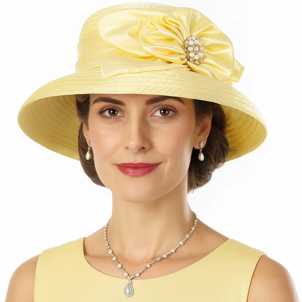 Light yellow satin church hat with pleated brim and soft pearl flower detail
