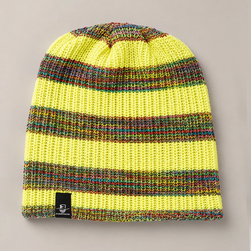 Yellow slouchy knit beanie with colorful rainbow stripe pattern and soft winter texture