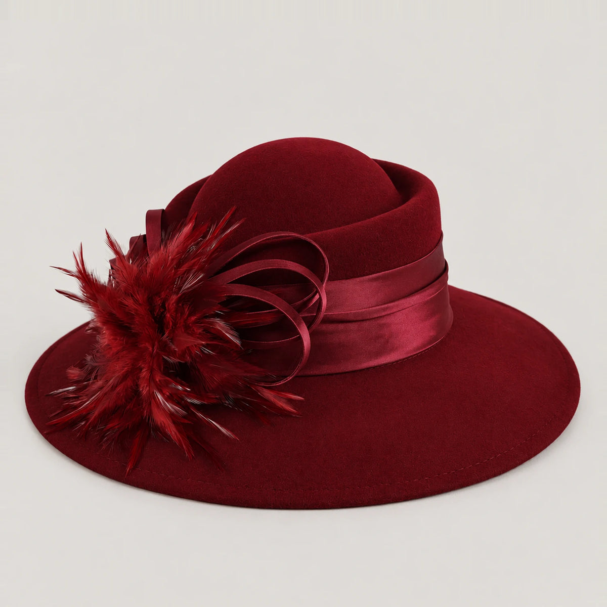 Burgundy Z029M wool church hat with a wide brim, feather detail and ribbon band