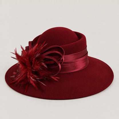 Burgundy Z029M wool church hat with a wide brim, feather detail and ribbon band
